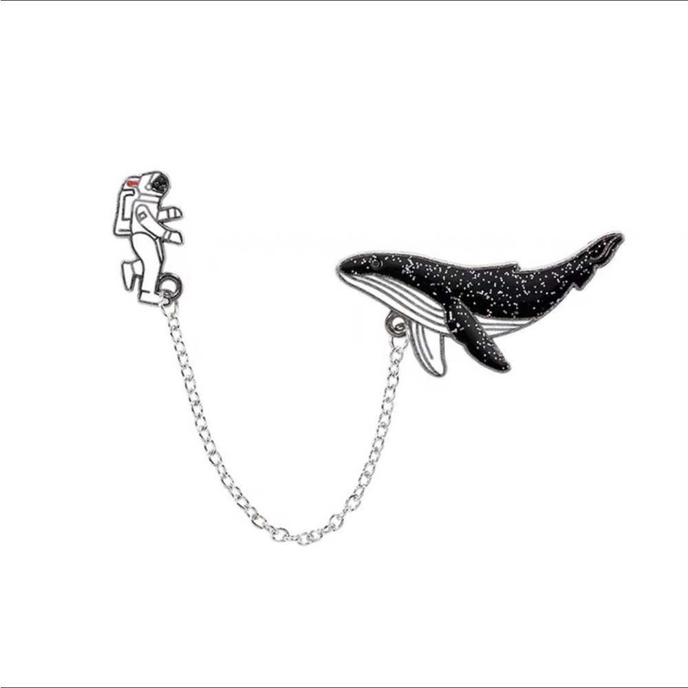 Astronaut with whale brooch and pin